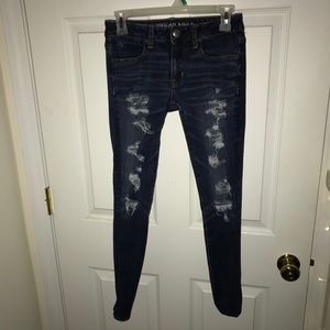 Holy dark blue jeans